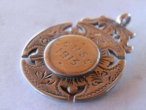 Antique sterling silver medallion - shipping R40 insured