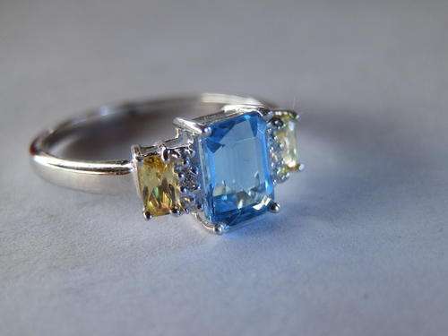 Sterling silver blue topaz and citrine ring - shipping R40 insured