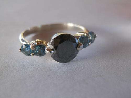 Sterling silver ring with black diamond and blue sapphires - shipping R40 insured
