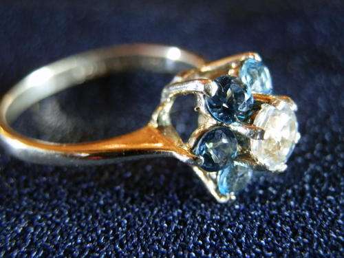 9ct Gold - 2.2 gram - London blue topaz and white sapphire cluster ring - two (2) weeks to pay