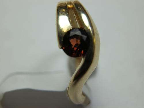 9 ct Gold (3 g)  garnet ring - thirty (30) days to pay.  Value R3,800