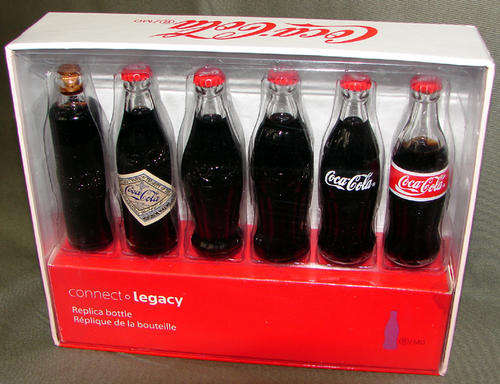 EVOLUTION OF THE COCA COLA BOTTLE - 6 MINIATURE COKE BOTTLES