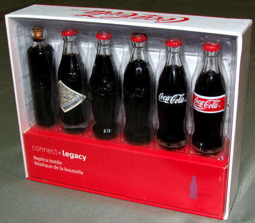 EVOLUTION OF THE COCA COLA BOTTLE - 6 MINIATURE COKE BOTTLES