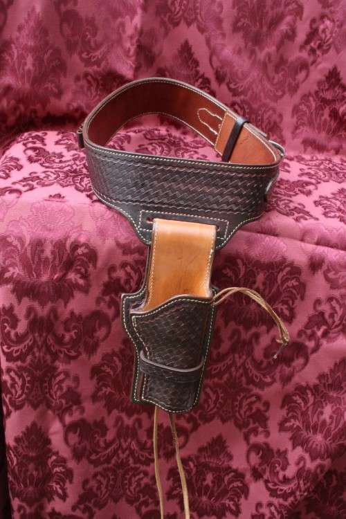 Cowboy belt and holster . Genuine leather