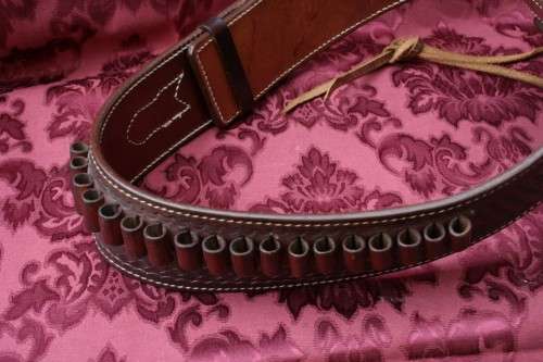 Cowboy belt and holster . Genuine leather