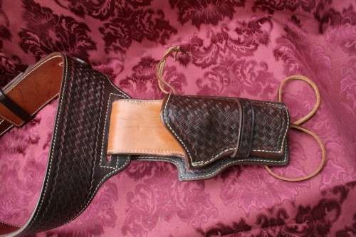 Cowboy belt and holster . Genuine leather