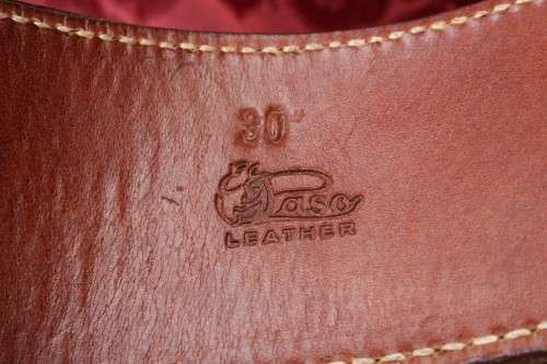 Cowboy belt and holster . Genuine leather