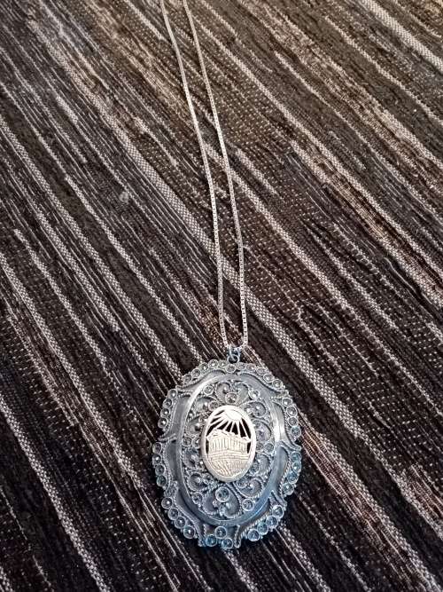 Sterling silver and gold pendant on chain