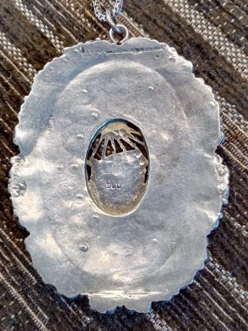 Sterling silver and gold pendant on chain
