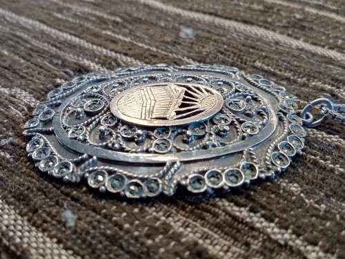 Sterling silver and gold pendant on chain