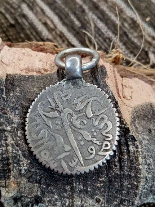 Ancient coin turned into pendant