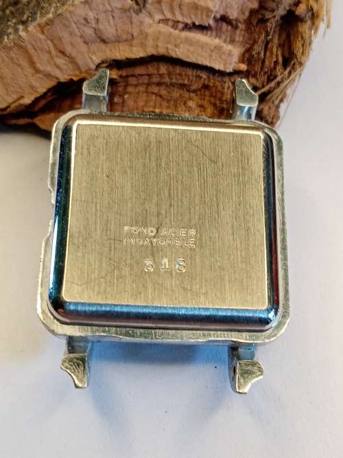 Square new old stock watch cases length: 24mm width: 23mm crystal intact