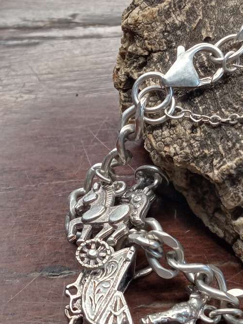 Sterling silver heavy charm bracelet 11 solid charms 265mm long