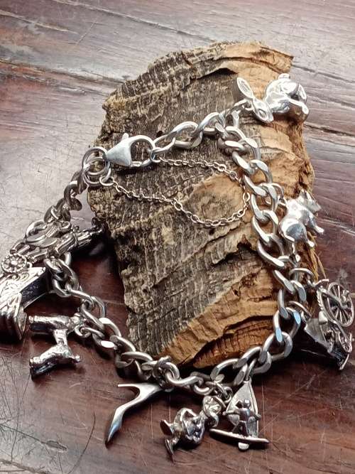 Sterling silver heavy charm bracelet 11 solid charms 265mm long