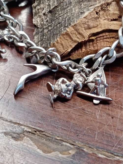 Sterling silver heavy charm bracelet 11 solid charms 265mm long