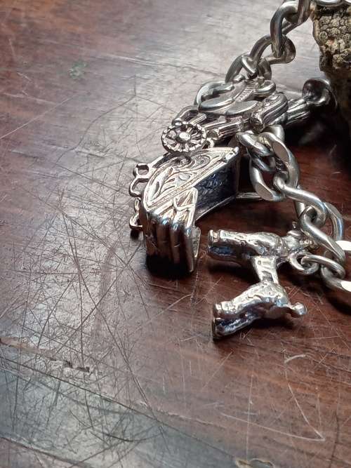 Sterling silver heavy charm bracelet 11 solid charms 265mm long
