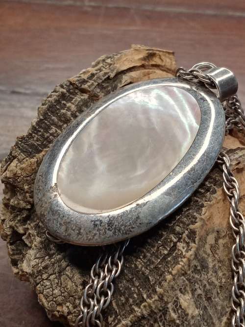 Sterling silver necklace with mother of pearl pendant size: 38mm by 26mm necklace length: 660mm
