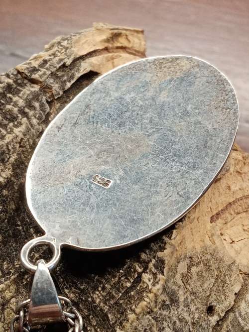 Sterling silver necklace with mother of pearl pendant size: 38mm by 26mm necklace length: 660mm