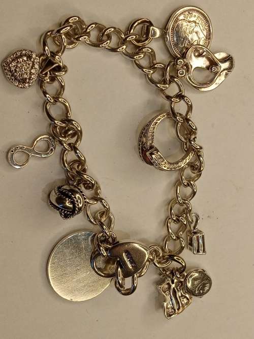 Sterling silver charm bracelet with 11 charms 21cm long