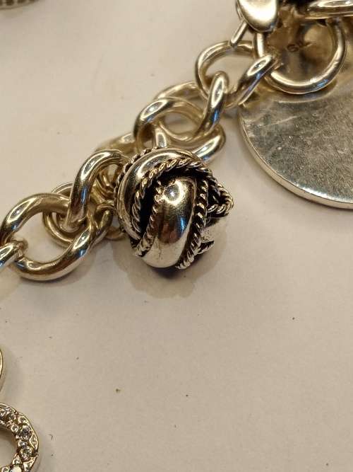 Sterling silver charm bracelet with 11 charms 21cm long