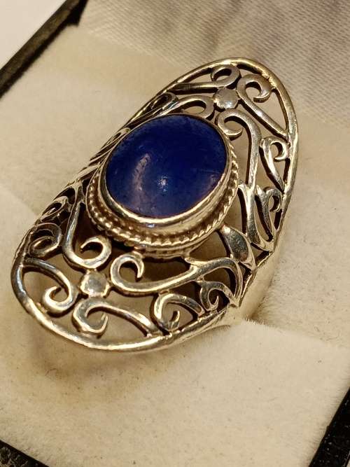 Sterling silver ladies ring with blue stone Size O.5