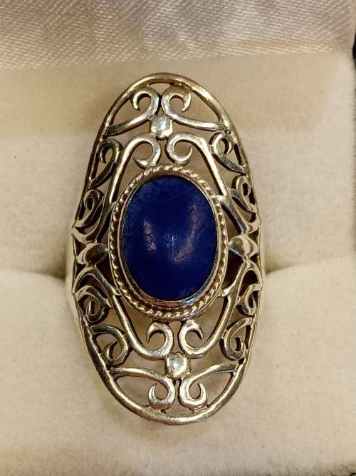 Sterling silver ladies ring with blue stone Size O.5
