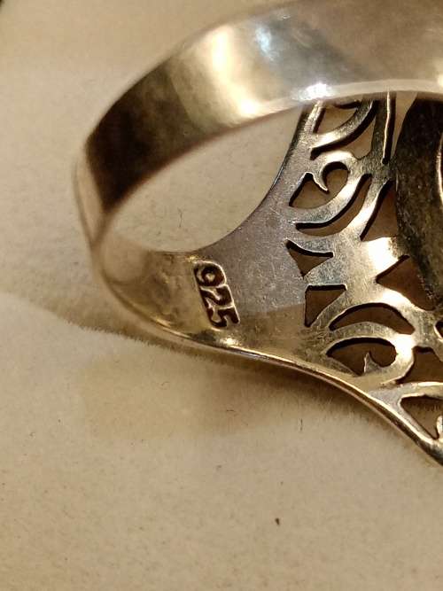 Sterling silver ladies ring with blue stone Size O.5