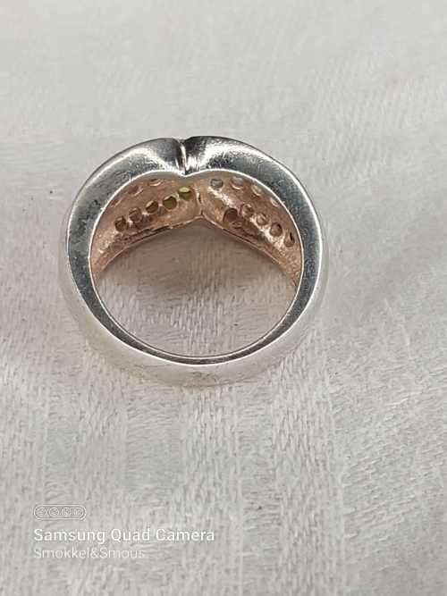 Sterling silver ladies ring with multi color Size: M.5