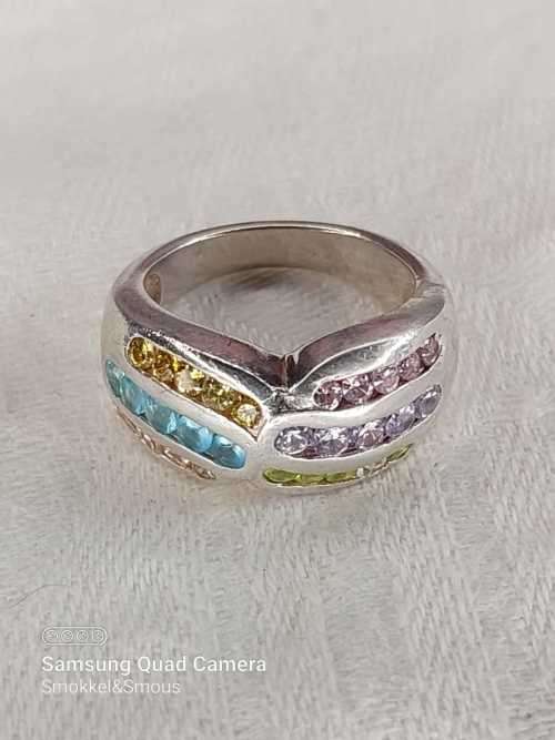 Sterling silver ladies ring with multi color Size: M.5