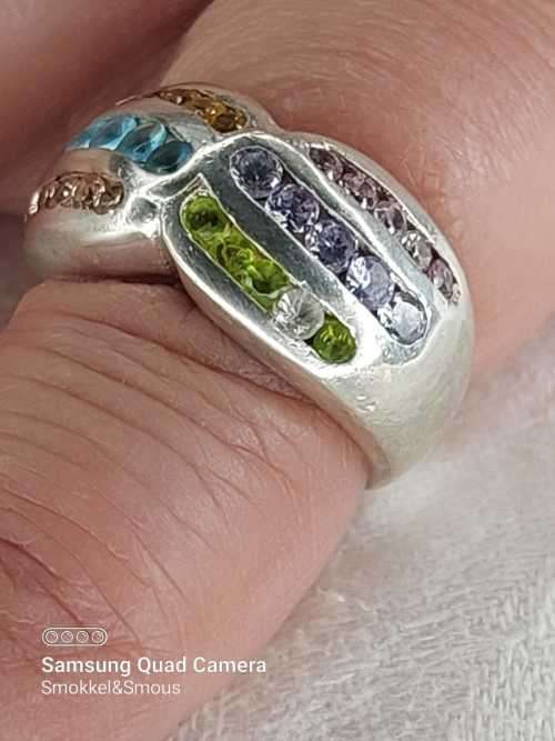 Sterling silver ladies ring with multi color Size: M.5