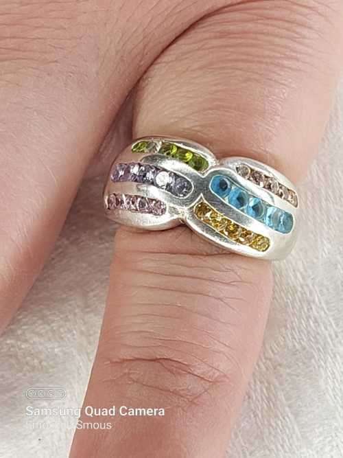 Sterling silver ladies ring with multi color Size: M.5