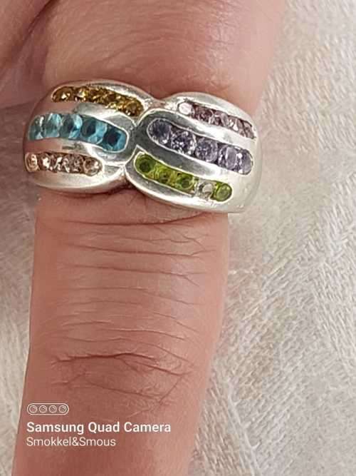 Sterling silver ladies ring with multi color Size: M.5