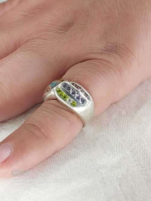 Sterling silver ladies ring with multi color Size: M.5
