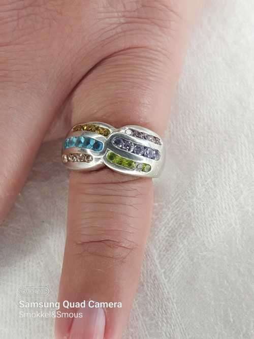 Sterling silver ladies ring with multi color Size: M.5