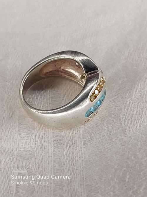 Sterling silver ladies ring with multi color Size: M.5