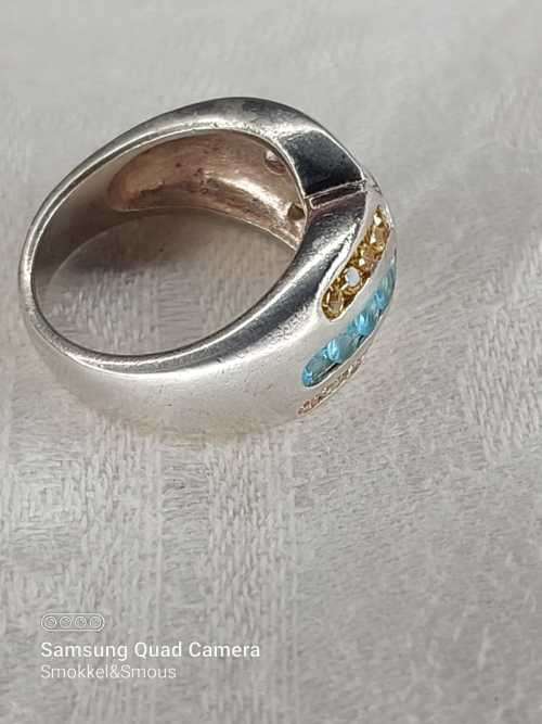 Sterling silver ladies ring with multi color Size: M.5
