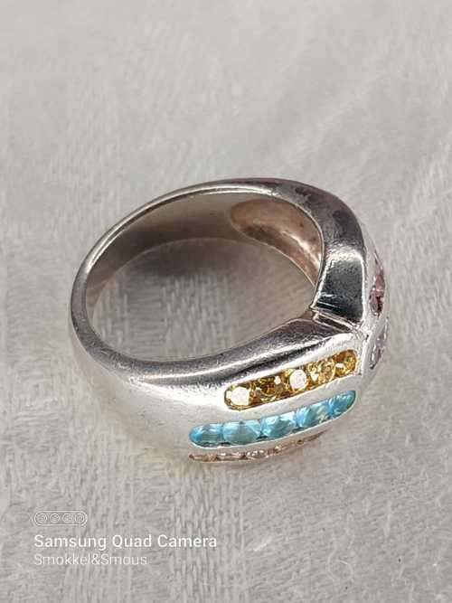Sterling silver ladies ring with multi color Size: M.5