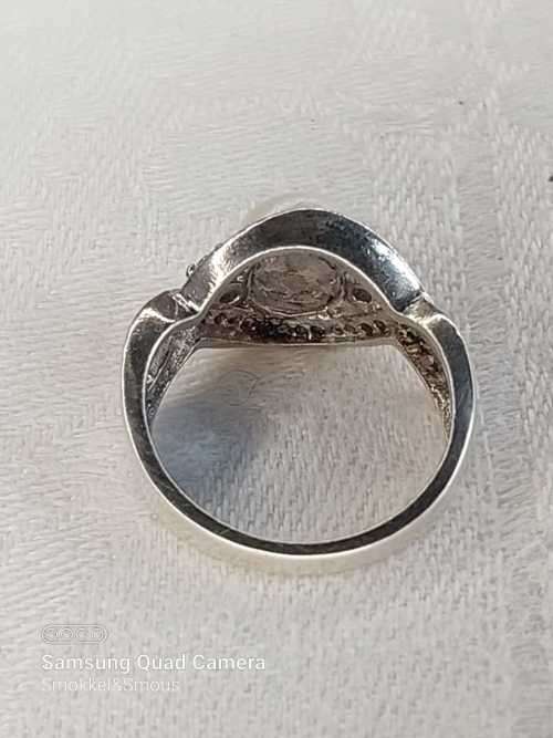 Sterling silver ladies ring with genuine pearl surrounded with cubic zirconia Size: O.5