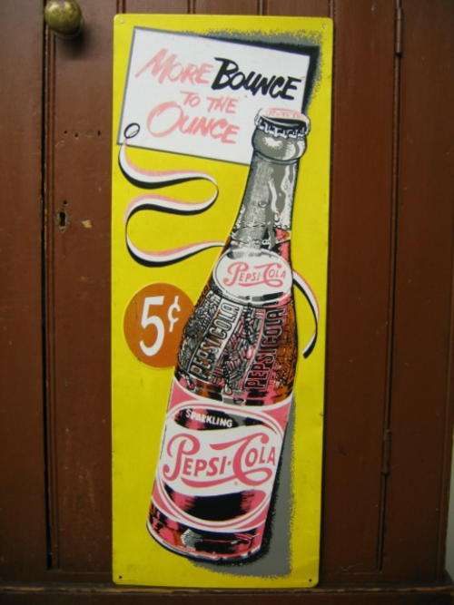 Pepsi-cola advert sign.