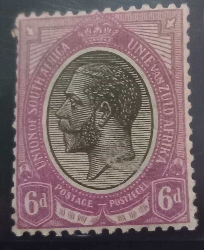 Union of SA 6d Kings Head with clear smudging of ink and black dot infront of kings nose