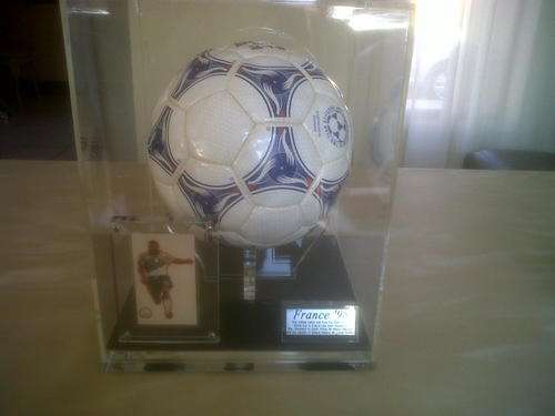Nelson Mandela (Madiba) / Lucas Radebe signed France1998 World Cup soccer ball in a case and stand