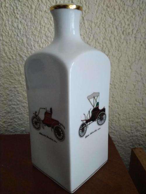 Unusual White vase / ornament with vintage vehicles
