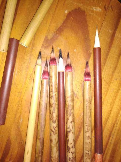 two brown China/ Chinese brushes *booked*