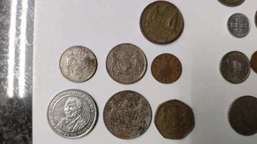 Lot of old SA coins, international coins, and tokens - all circulated - incl Jonty Rhodes