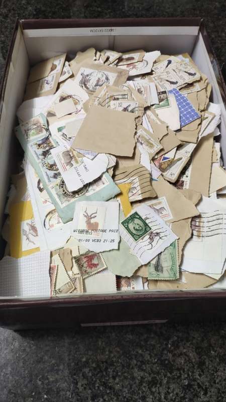 Shoe box with stamps. Many South African definatives and some from other southern african countries