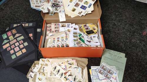 Shoe box full of stamps from all over the world