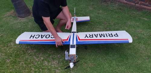 R/C Plane in 7/10 condition. Needs minor attention.  4 Servos, O.S. Max 75AX Two Stroke Glow Engine