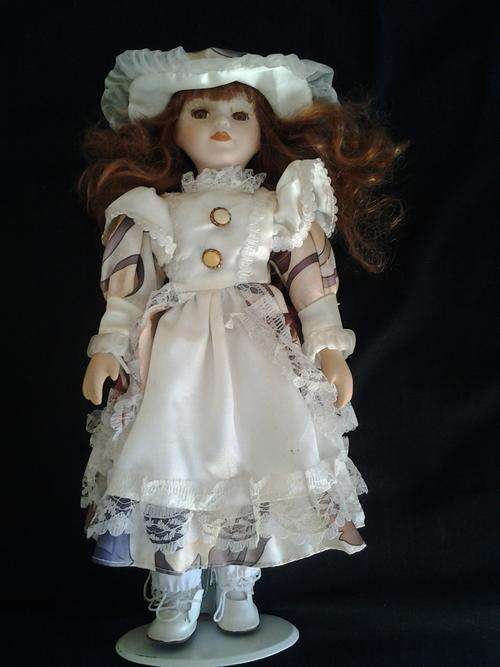 Porcelain doll with hat