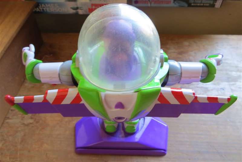 Large Disney Pixar Buzz Lightyear toy on stand