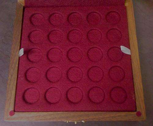 Walnut Display case for commemrative Tickeys in capsules.